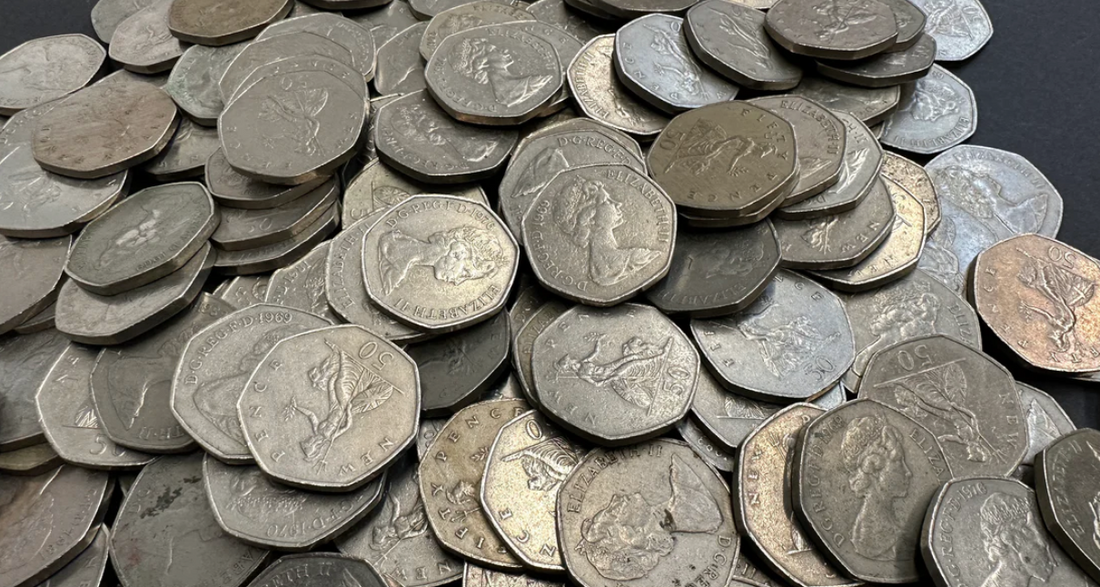 Large pile of old 50 pence pieces